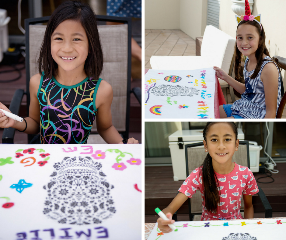 birthday party guests decorating pillow covers