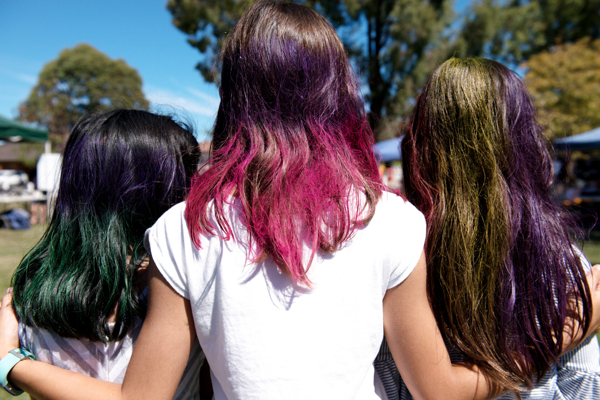 wacky hair colours on three girls at the fete